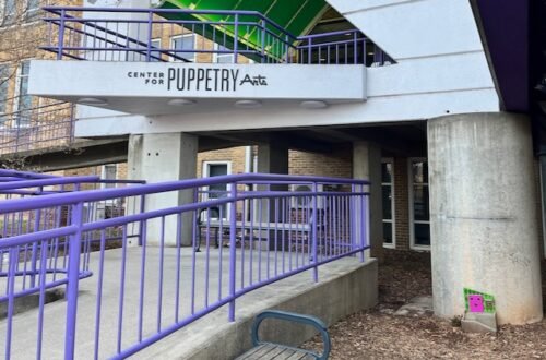 The entrance to Atlanta's Center for Puppetry Arts with a tiny door in the bottom right hand corner