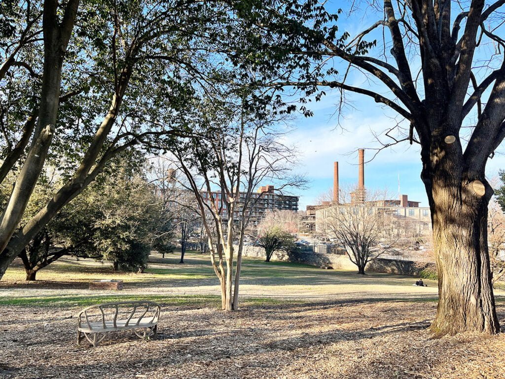 Potters Field with the Fulton Cotton Mill Lofts beyond at Oakland Cemetery | atlantaandbeyond.com