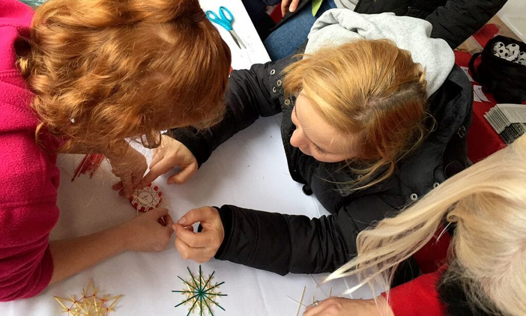Making Straw Star Ornaments at the AIS Christmas Market in Atlanta | atlantaandbeyond.com