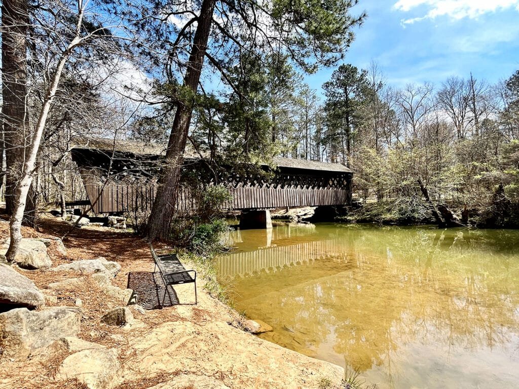 Historic Poole's Mill Covered Bridge built in the lattice truss style spans Settendown Creek in Forsyth County, Georgia | atlantaandbeyond.com