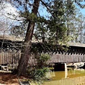 Historic Poole's Mill Covered Bridge built in the lattice truss style spans Settendown Creek in Forsyth County, Georgia | atlantaandbeyond.com