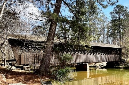 Historic Poole's Mill Covered Bridge built in the lattice truss style spans Settendown Creek in Forsyth County, Georgia | atlantaandbeyond.com