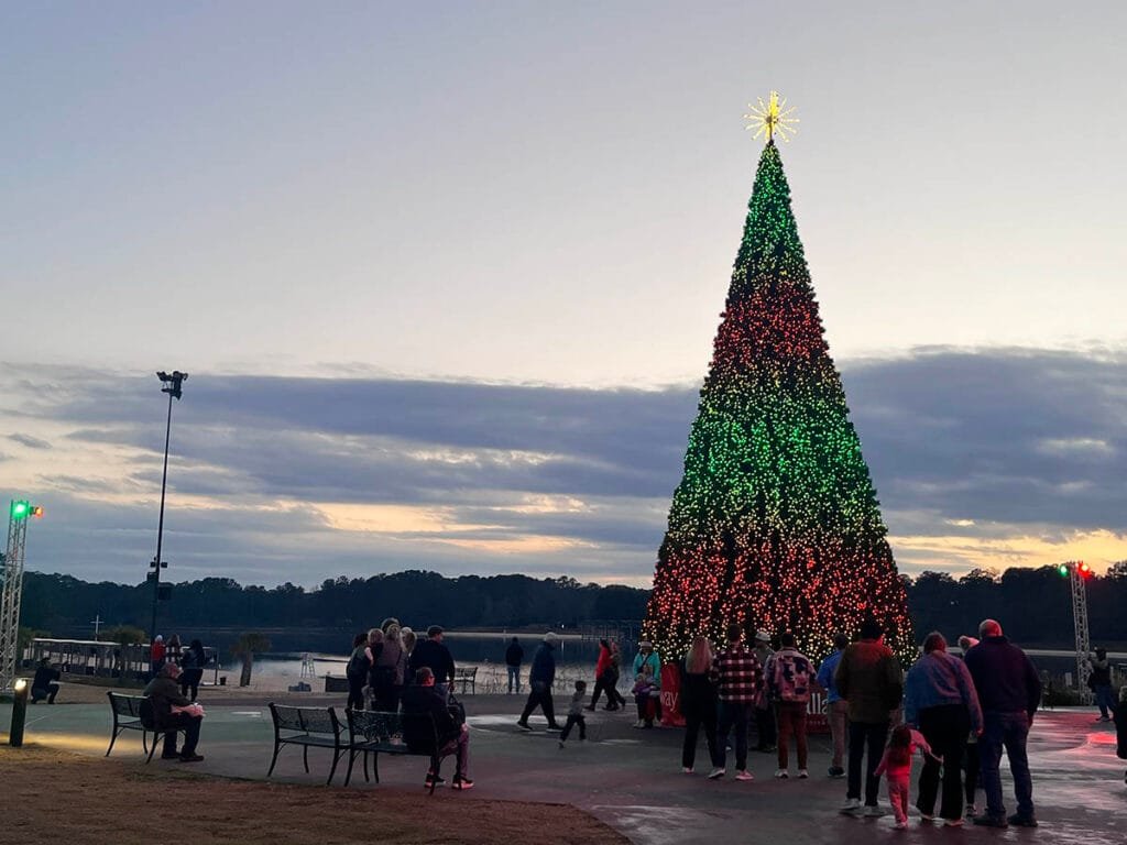 The Tree of Traditions Pixel Pine is a 40-foot-tall tree standing at Robin Lake Beach that puts on a dazzling light display on its own. | atlantaandbeyond.com