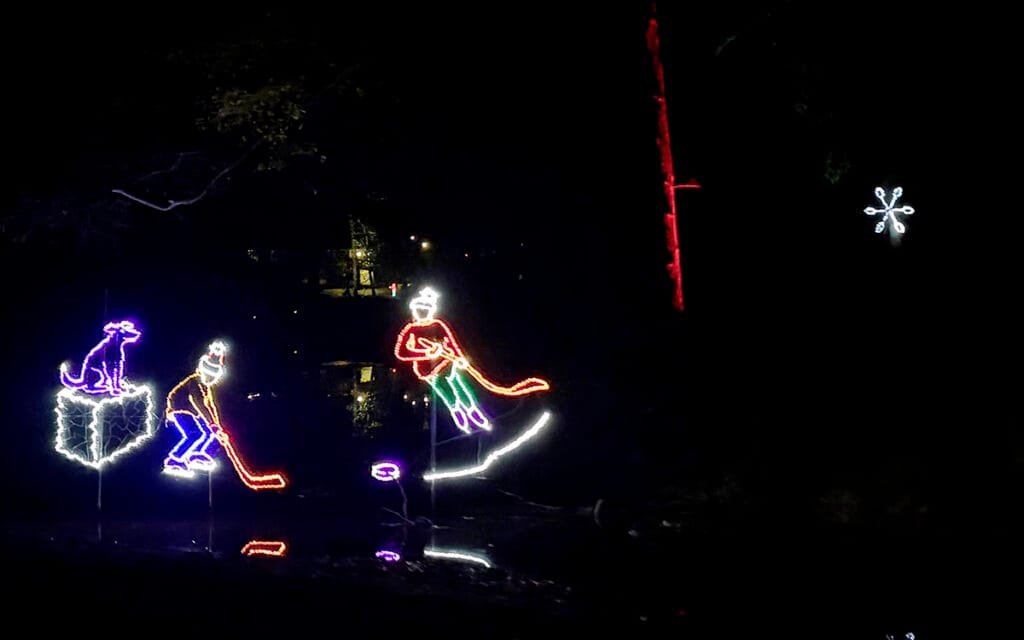 we saw, ice skaters on the lake, couples dancing, families playing and children snow-sledding to We Wish You a Merry Christmas | atlantaandbeyond.com