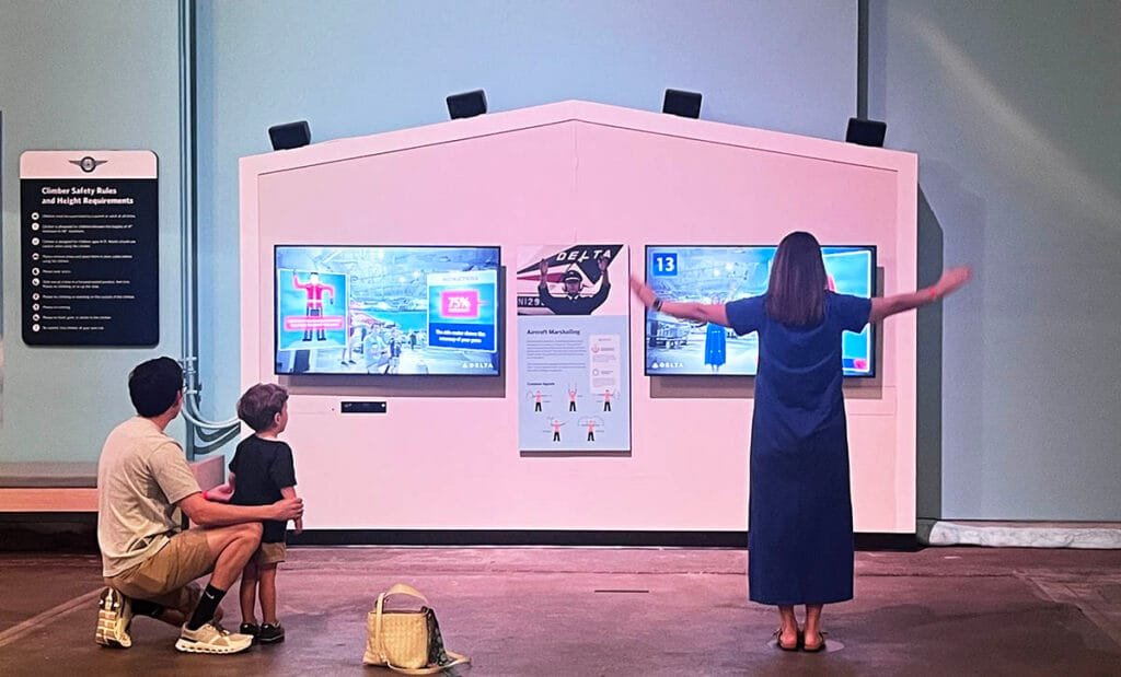 Learn Aircraft Marshalling in the Aviation Adventure play space | atlantaandbeyond.com